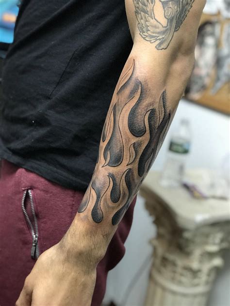 black and grey flames tattoo